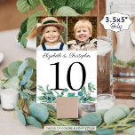 Tarjeta De Mesa Eucalyptus 2 Boda fotográfico Número de tabla Rótu<br><div class="desc">Elegante número de la mesa de bodas con dos fotos personalizadas, nombres de la novia y del novio y acentuadas con hojas de eucalipto acuarela. Incluya varias fotos de la pareja a lo largo de los años o sus fotos de compromiso para un entretenido cartel de mesa para los invitados...</div>