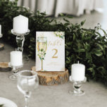 Tarjeta De Mesa Glass de champán floral blanco y dorado personaliz<br><div class="desc">Esta hermosa tarjeta floral cuenta con flores acuáticas y tu texto personalizado a ambos lados de la tarjeta. Utilice la plantilla para rellenar su información. La función "Personalizar más adelante" se puede utilizar para cambiar el tipo de letra (tamaño, estilo, color), añadir más líneas de texto o cambiar el diseño....</div>