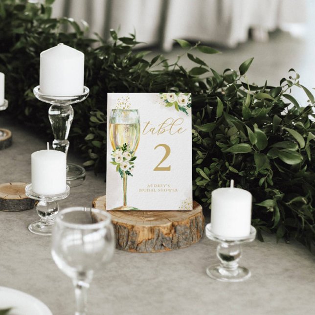 Tarjeta De Mesa Glass de champán floral blanco y dorado personaliz (Subido por el creador)