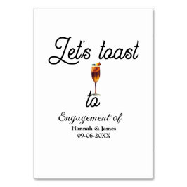 Tarjeta De Mesa Let's toast to engagement party name date glass