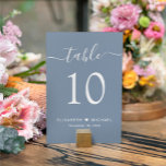 Tarjeta De Mesa Moda Script Dusty Blue Wedding Recepción<br><div class="desc">Moda polvorienta señal de número de la mesa de la recepción de boda azul con "mesa" en un elegante guión de caligrafía blanca con toques, el número de la mesa en una elegante tipografía serif blanca, sus nombres unidos por un corazón y la fecha de recepción. Cree cada signo de...</div>