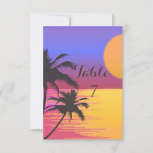Tarjeta de mesa para boda en la playa al atardecer