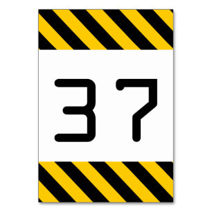 Tarjeta de mesa rayada negra y amarilla