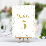 Tarjeta De Mesa Relieve metalizado Purpurina Faux Gold Elegant Con<br><div class="desc">Añade un toque de brillo y sofisticación a tu recepción de bodas con estos elegantes números de mesa. Con una delicada dispersión de falsos puntos de confeti purpurina de oro sobre un fondo blanco crujiente, estas tarjetas crean un aspecto moderno y de moda. Fácilmente personalizable con sus números de tabla...</div>