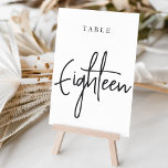 Tarjeta De Mesa Tabla con guiones de mano blanca y negra dieciocho<br><div class="desc">Las tarjetas de número de tabla simples y de moda en blanco y negro clásicos hacen una declaración elegante en su boda o evento. Las funciones de diseño "table [number]" se encuentran en una mezcla de letras clásicas de sif y manuscritas. El diseño se repite en ambos lados. Las tarjetas...</div>