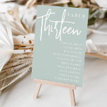 Tarjeta De Mesa TRECE DE LA Tabla con guiones manuales   nombres d<br><div class="desc">Las tarjetas de número de tabla simples y de moda en Sage Green y en blanco hacen una declaración elegante en su boda o evento. Las funciones de diseño "table [number]" se encuentran en una mezcla impresionante de letras clásicas de sif y manuscritas, con nombres de invitados individuales debajo. El...</div>