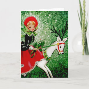 Tarjeta de Navidad antigua con dama montando un ci