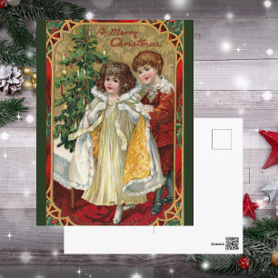 Tarjeta de Navidad antigua de 1910 con niño y niña