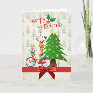 Tarjeta de Navidad con el reno en la bicicleta