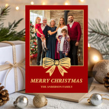 Tarjeta de Navidad con lazo rojo y dorado para fot