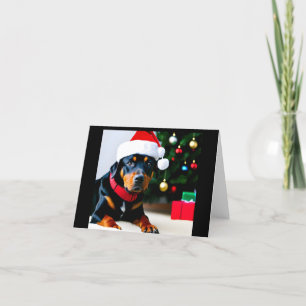 Tarjeta de navidad con Rottweiler usando sombrero 