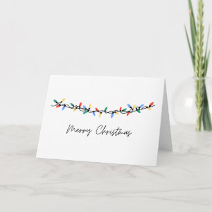 Tarjeta de navidad de las luces en blanco