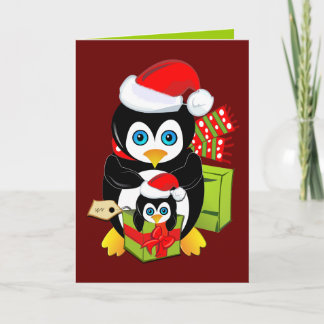 Tarjeta de Navidad linda con los pingüinos y el