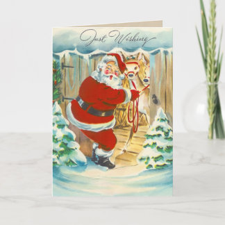 Tarjeta de Navidad linda de Santa y del reno
