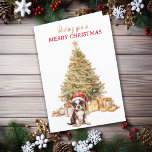 Tarjeta de Navidades de Cachorro del Árbol de Oro<br><div class="desc">En la parte delantera de esta tarjeta de Navidades, un adorable cachorro del Boston Terrier usa un gorra de Santa Claus rojo y blanco mientras se sienta frente a un árbol de vacaciones. El árbol está decorado en oro, y debajo hay paquetes de regalos a juego. El texto dorado y...</div>