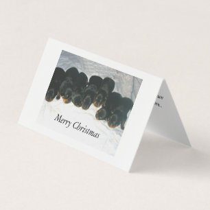 Tarjeta de Navidades de cachorros de Rottweiler