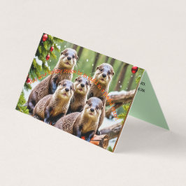 Tarjeta de Navidades de nutrias juguetonas