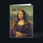 Tarjeta de Navidades Sleigh de la Mona Lisa Santa<br><div class="desc">Un Papá Noel vintage y su trineo lleno de juguetes vuelan por el cielo al fondo de la famosa Mona Lisa con su misteriosa sonrisa. Una de una serie de tarjetas de Navidades de artistas. El interior está en blanco para tu propio mensaje personal.</div>