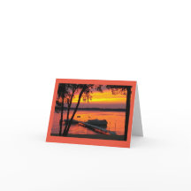 Tarjeta de nota en blanco con puesta de sol sobre 