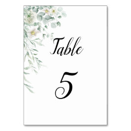 Tarjeta de número de mesa con vegetación de eucali