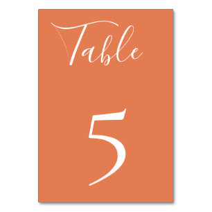 Tarjeta de número de mesa naranja polvorienta