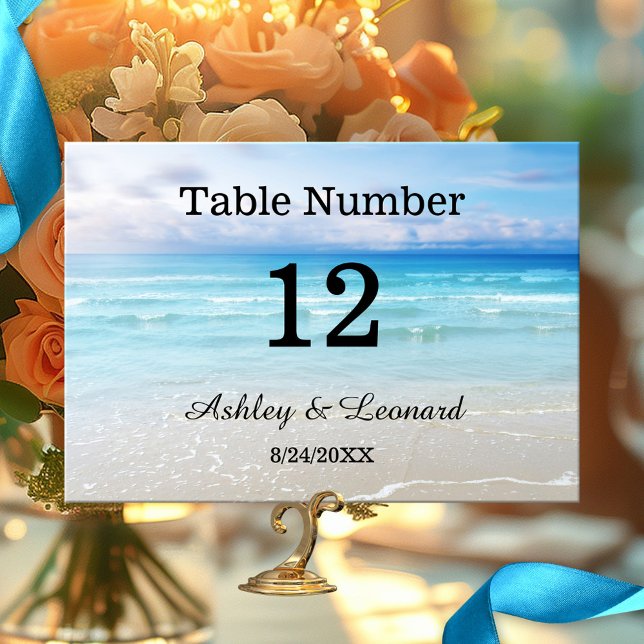 Tarjeta de número de tabla de casamiento artístico (Wedding table number card featuring a simple painting of a beach in vibrant colors)
