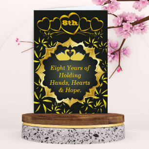 Tarjeta de oro y negro para el octavo aniversario 