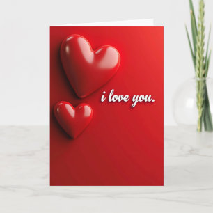 Tarjeta de papel de oro falso con corazones rojos