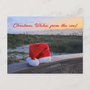 Tarjeta de poste de tema de playa con Santa Hat