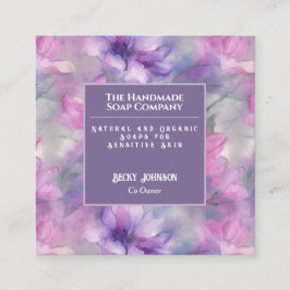 Tarjeta de presentación de flores rosadas y morada