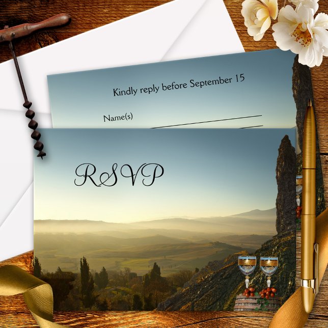 Tarjeta de respuesta de temática de viñedo o vino (Modern RSVP card with two glasses and grapes on a wine barrel, overlooking a beautiful landscape)