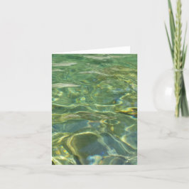 tarjeta de saludo de agua verde iluminada por el s