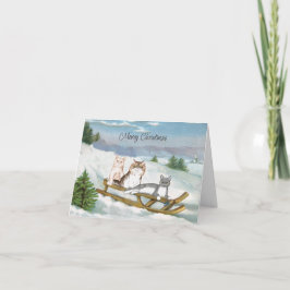 Tarjeta de tres gatos en una escena de invierno es
