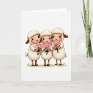 Tarjeta de tres ovejas con flores