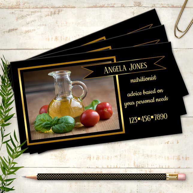 Tarjeta de visita dietista profesional nutricionis (Business card featuring a still life image with olive oil and tomatoes with basil and golden lining)