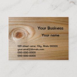 Tarjeta de visita en la madera inacabada