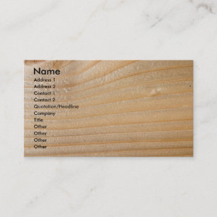 Tarjeta de visita en la madera inacabada