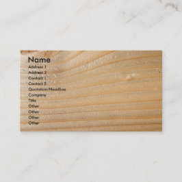 Tarjeta de visita en la madera inacabada