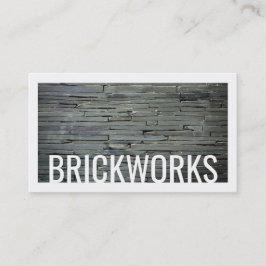 Tarjeta de visita gris del fondo del ladrillo de