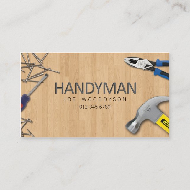 Tarjeta De Visita Hogar Handyman repara las uñas martillo en madera (Anverso)