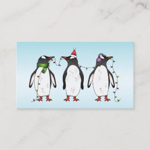 Tarjeta De Visita Tres pingüinos navideños festivos sobre azul claro