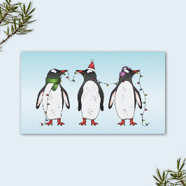 Tarjeta De Visita Tres pingüinos navideños festivos sobre azul claro