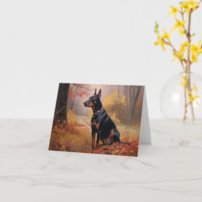 Tarjeta Doberman en otoño inspira caída de hojas (flor amarilla)