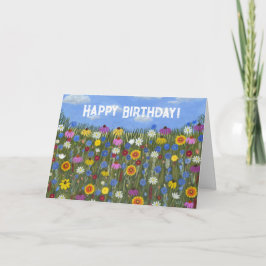 Tarjeta doblada con flores silvestres y margaritas