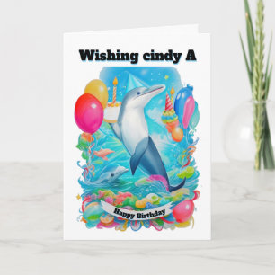 Tarjeta Dolphin Vestido gorra de cumpleaños sosteniendo el