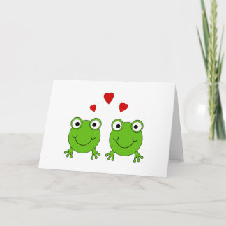 Tarjeta Dos ranas verdes con corazones rojos.