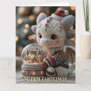 Tarjeta Dragón de peluche navideño lindo con globo de niev