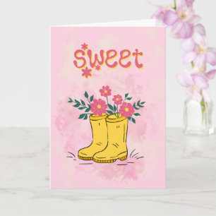 Tarjeta Dulce título con botas de lluvia amarillas y flore