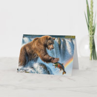 El oso pardo de cumpleaños toma un salmón