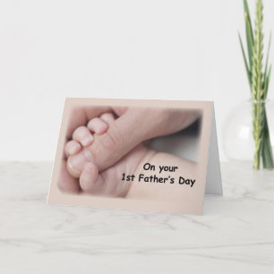 Tarjeta El primer día de padre, manos del bebé que